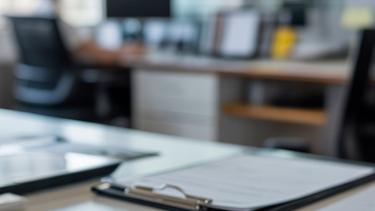 Insurance claim documents with car key